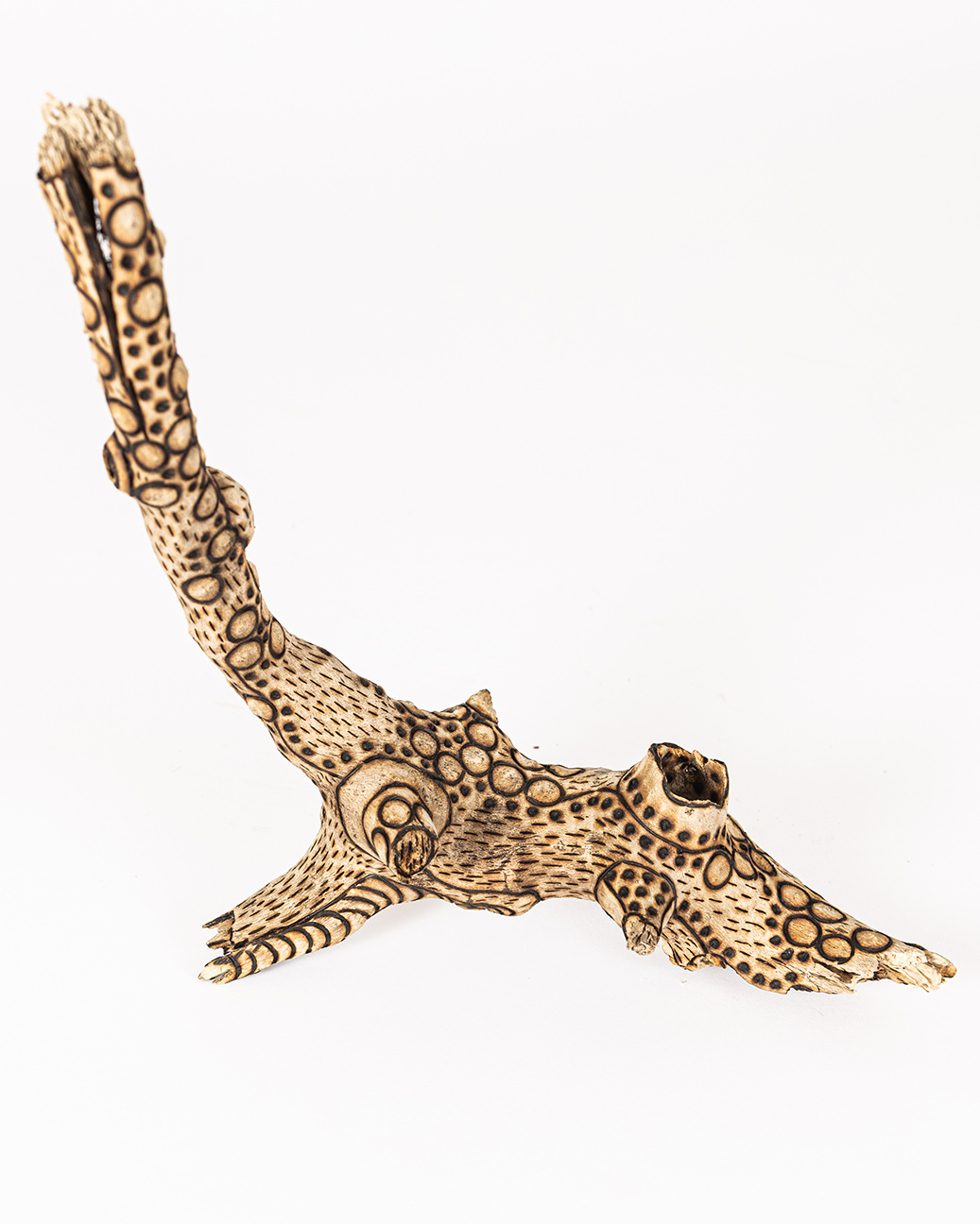 tattooed wood art piece