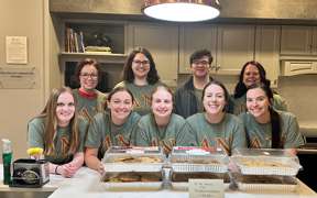 Students serving meal at the Ronald McDonald House