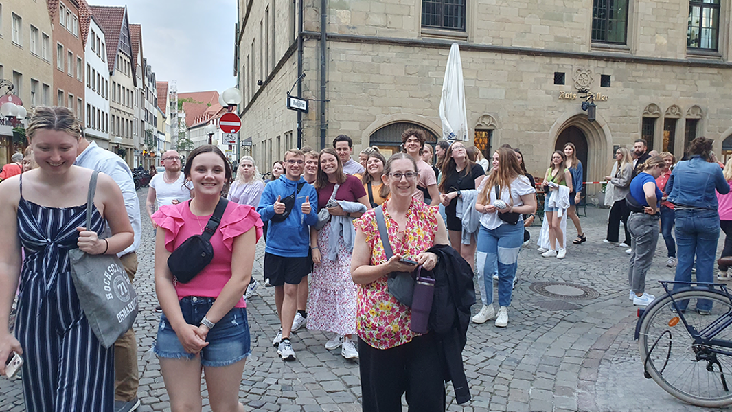 USI student tourists walk a cobblestone street in Germany