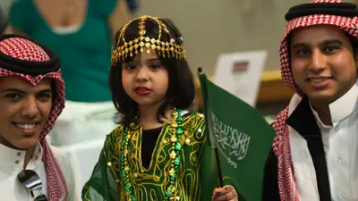 Arabic students and child at the International Food Expo