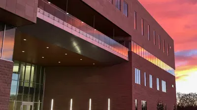 Exterior view of the Business and Engineering Center at dusk