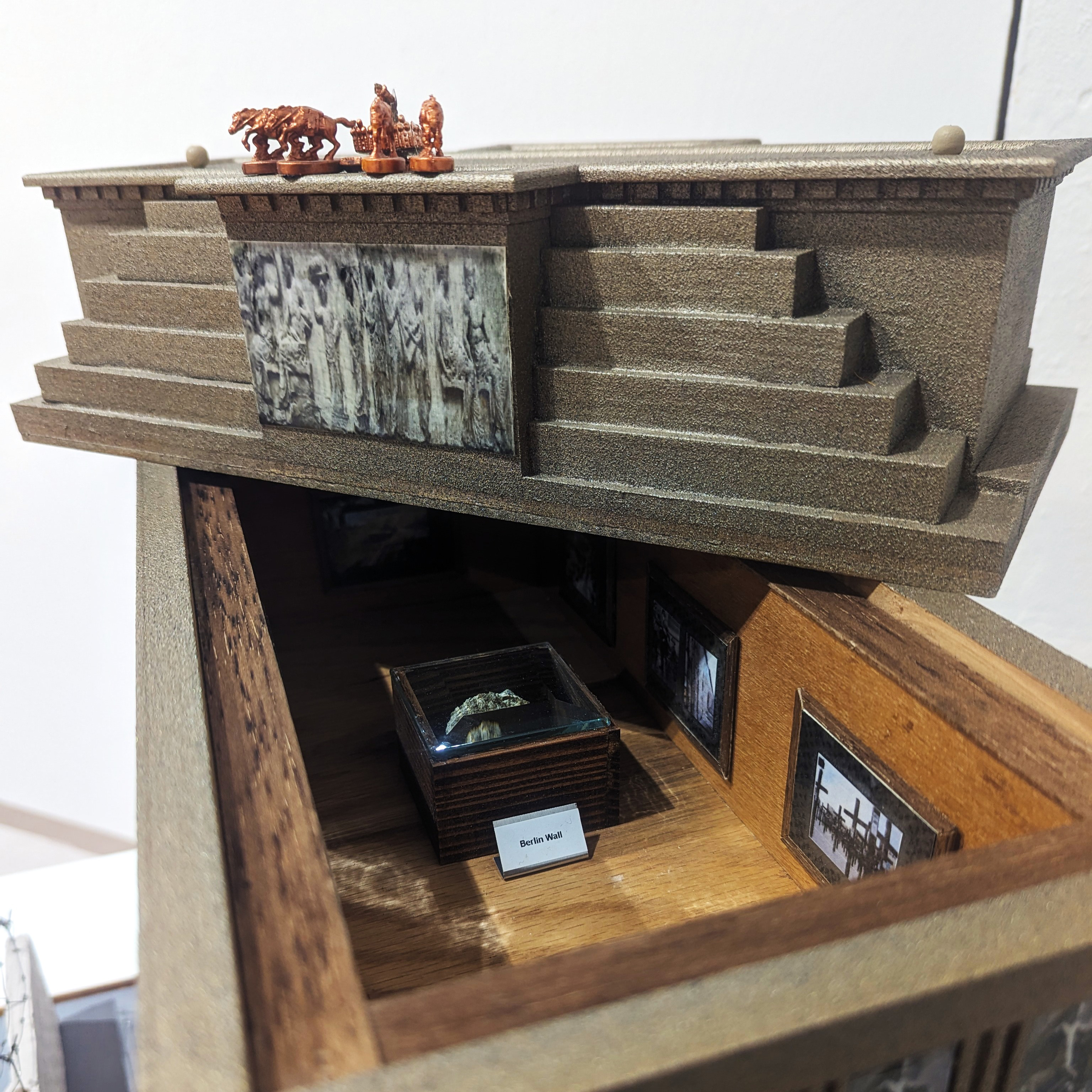 Decorative wooden box with a lid and a miniature art exhibit inside
