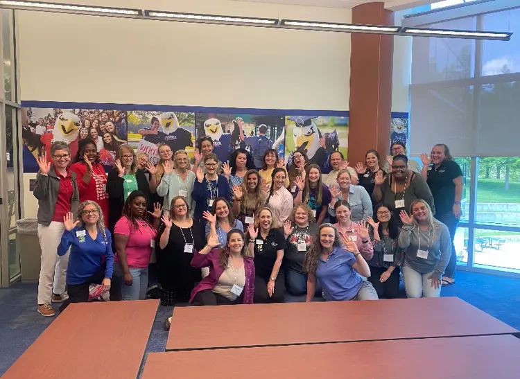 25 recently certified Positive Approach to Care Trainers and their Mentors