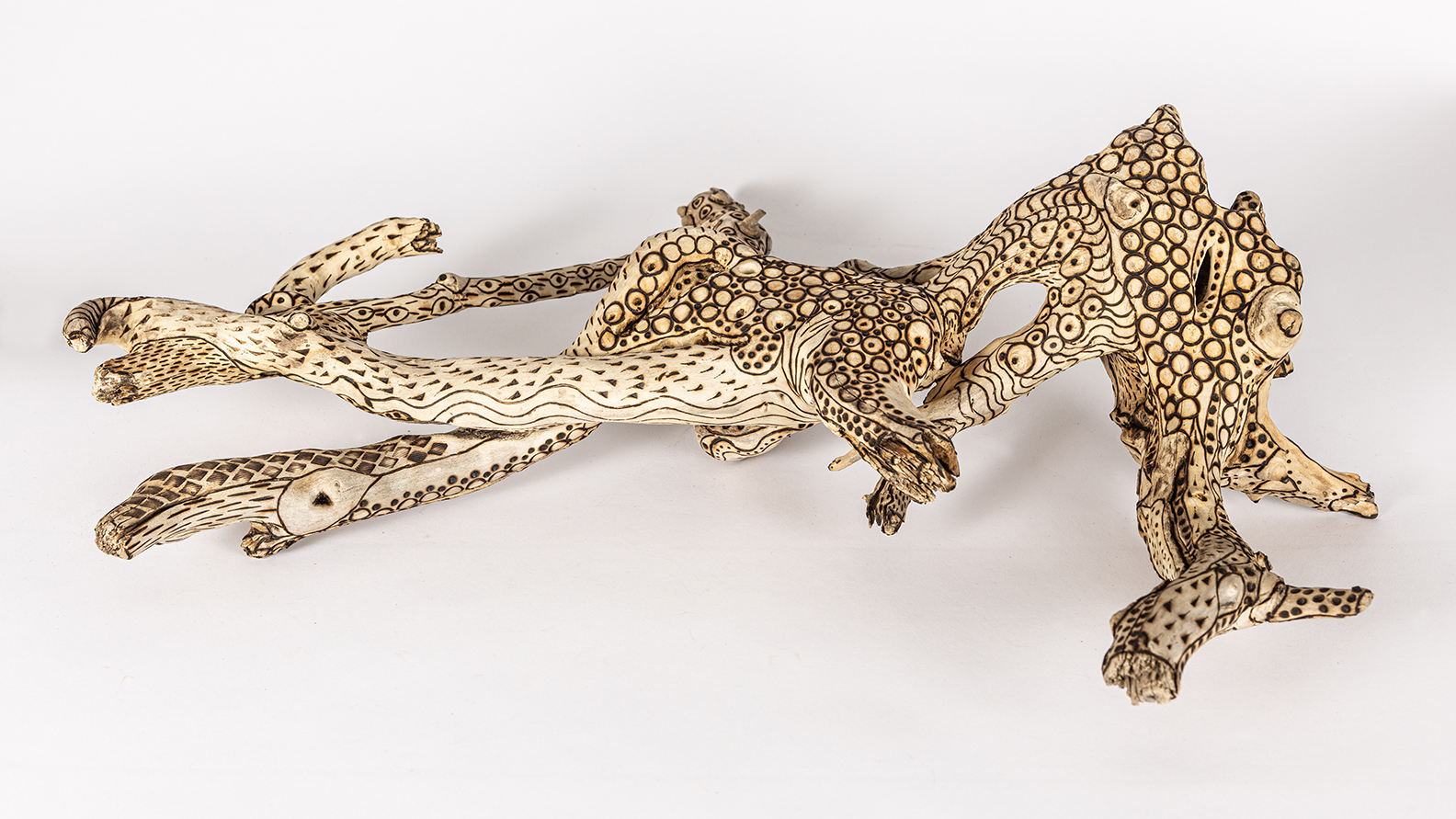 tattooed wood art piece
