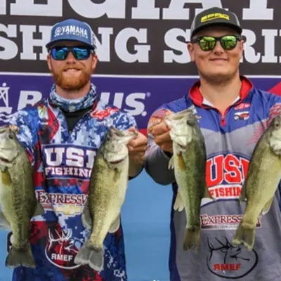 USI students showing off the fish they caught at a competition