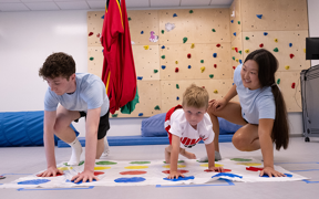 OT students playing game with child