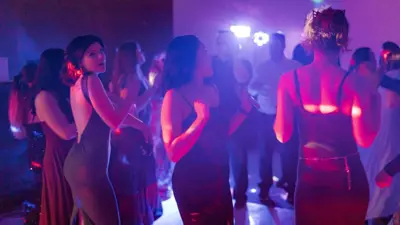 A group of students dancing at a party.