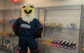 Archie Eagle standing in front of pantry shelves