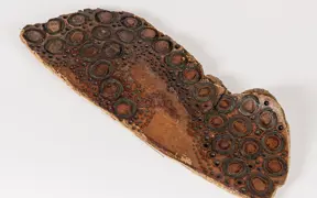 tattooed wood art piece