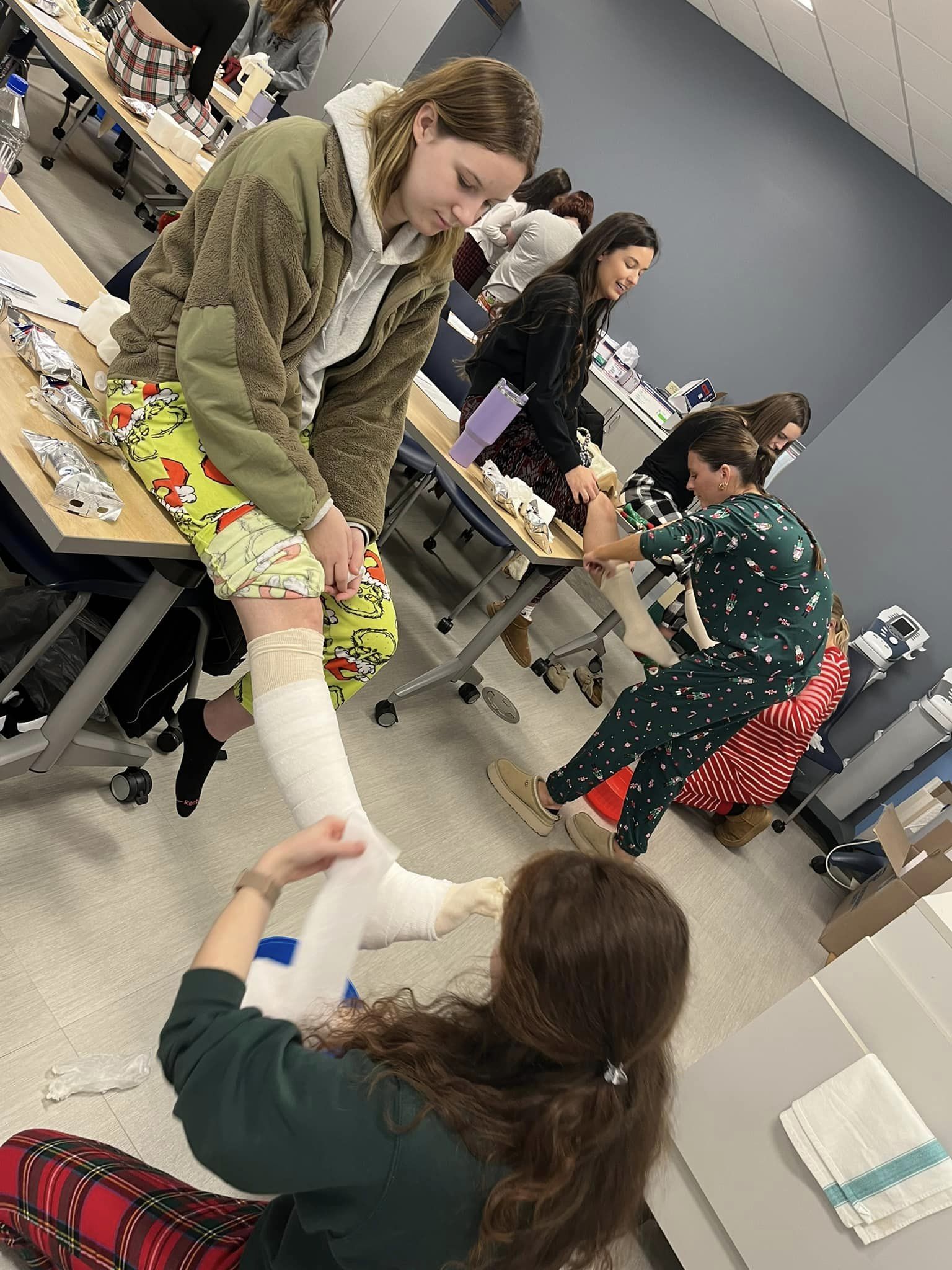 OTA students practicing making casts