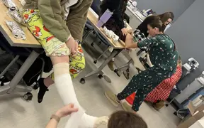 OTA students practicing making casts