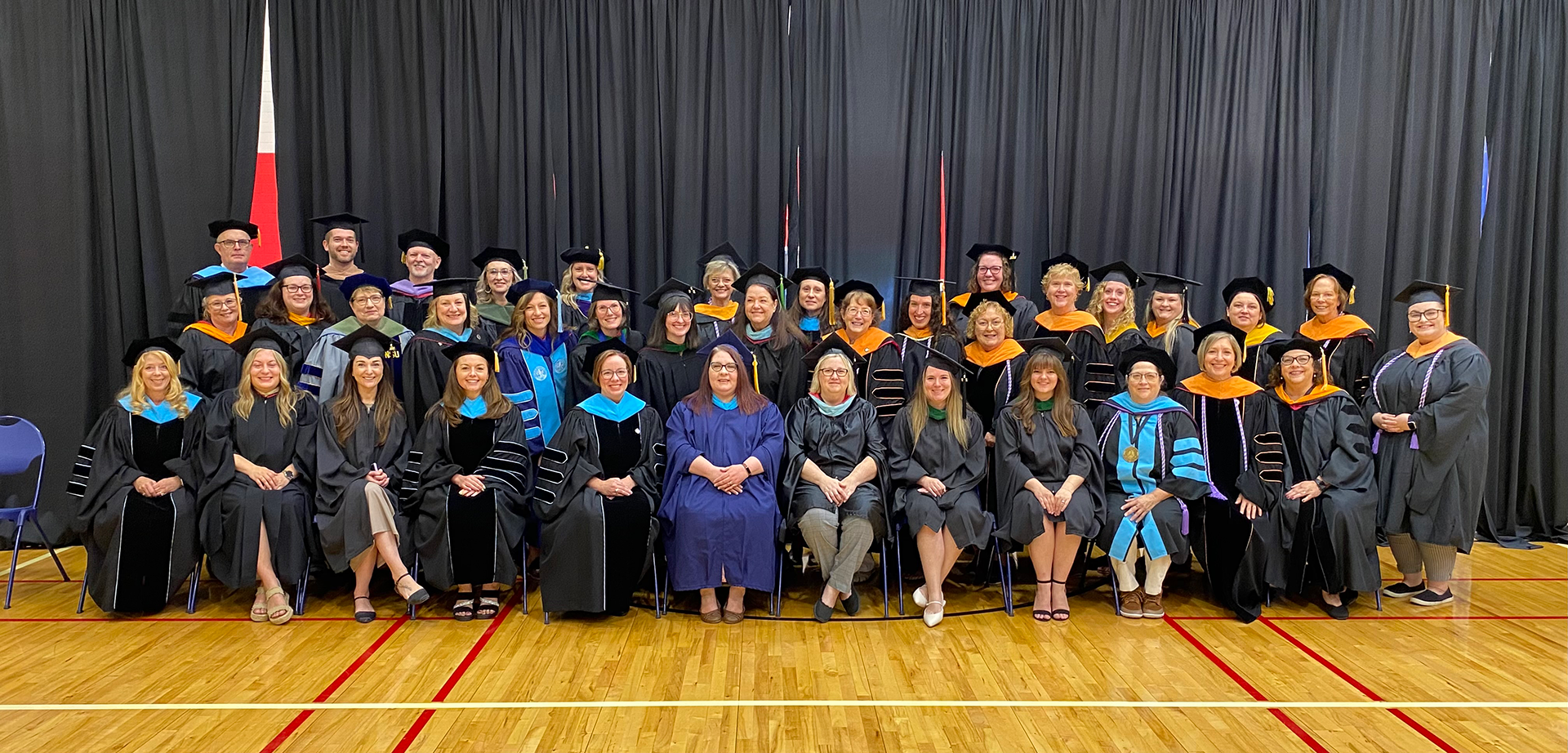 Photo of College faculty in their commencement regalia