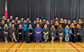 Photo of College faculty in their commencement regalia
