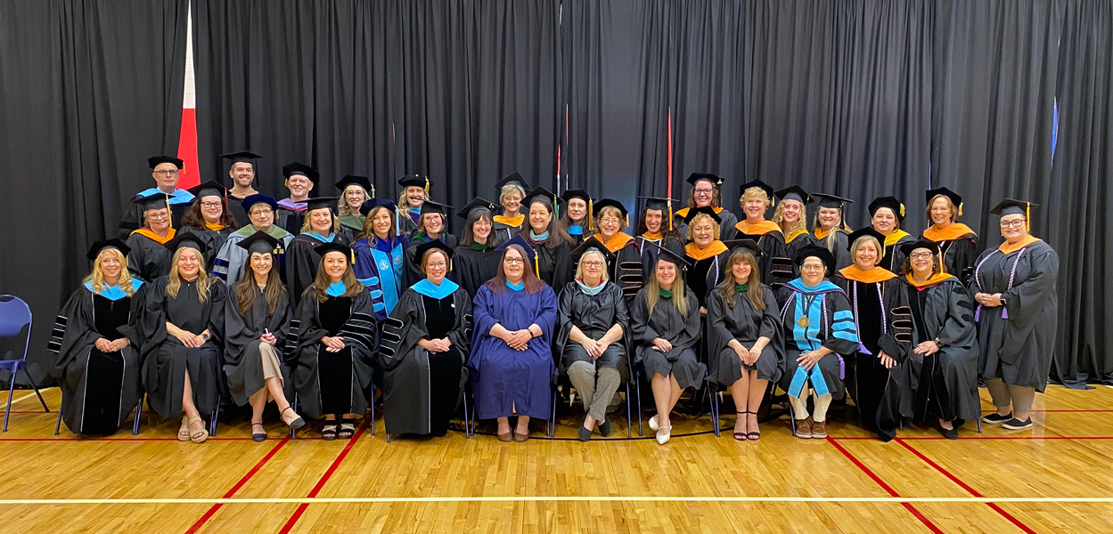 Photo of College faculty in their commencement regalia