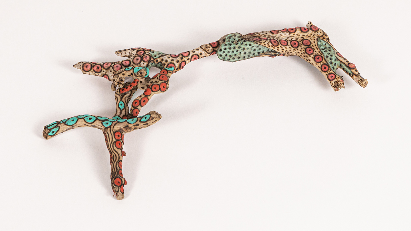 tattooed wood art piece