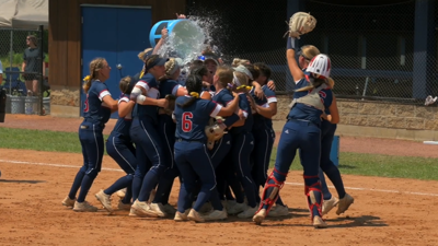 team celebrating a win dumping water cooler