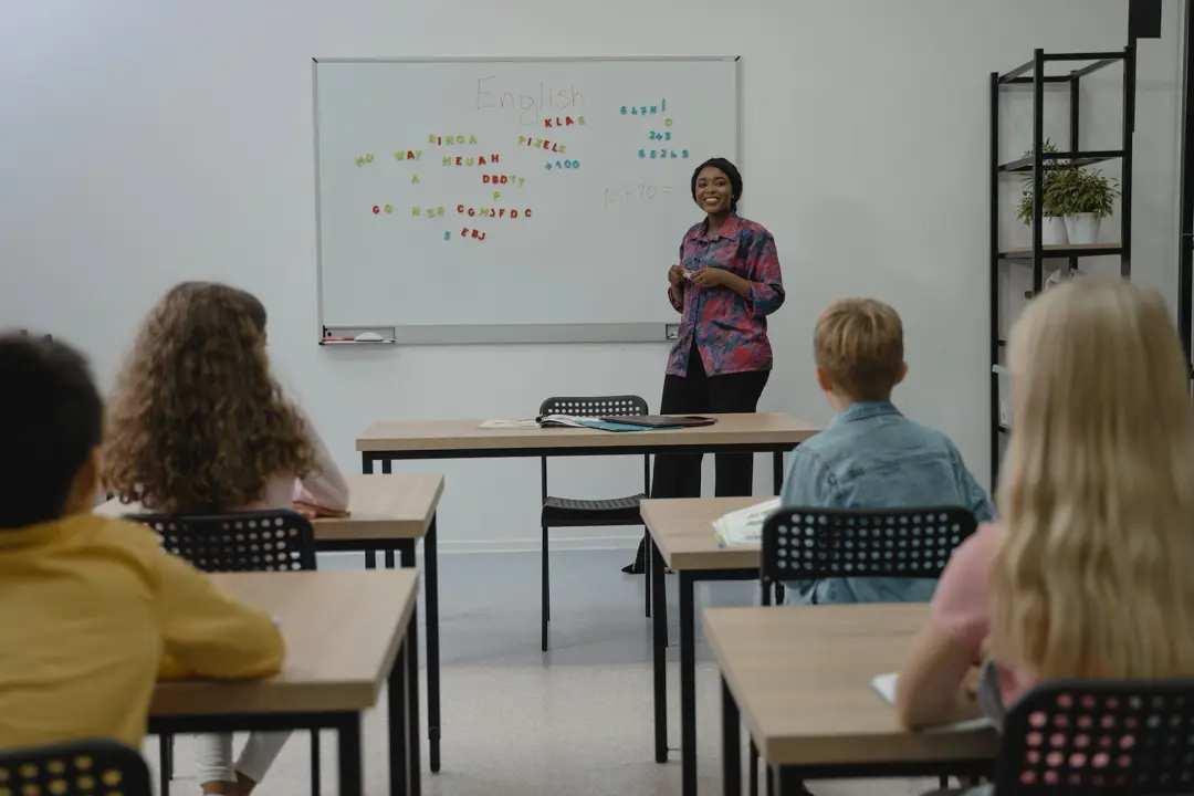 A teacher instructs elementary students in English