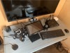 photo of a desk with screen devices on it