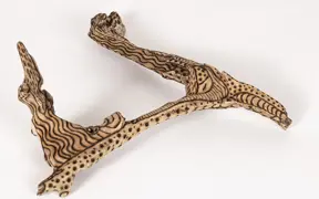 tattooed wood art piece