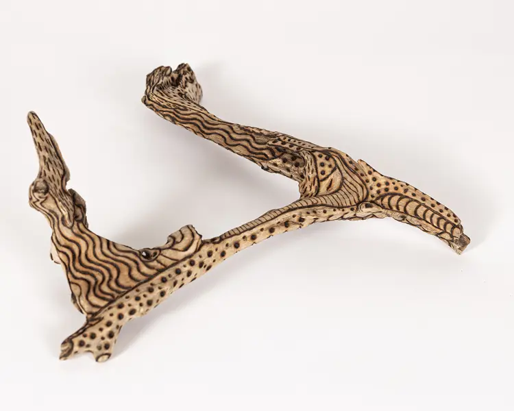 tattooed wood art piece
