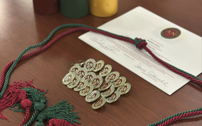 Photo of pins given during honor society induction