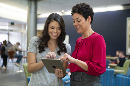 Dr. Cristina Gilstrap works with a student