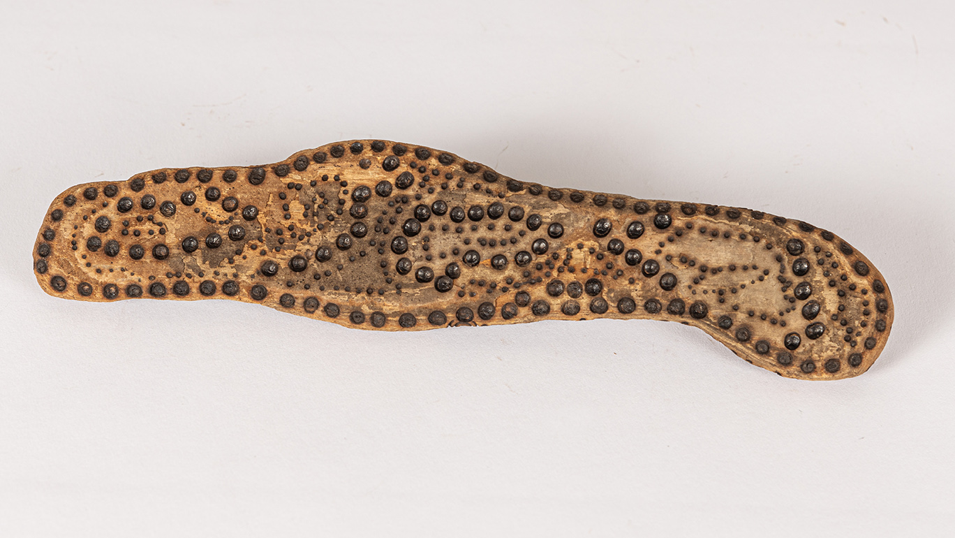 tattooed wood art piece