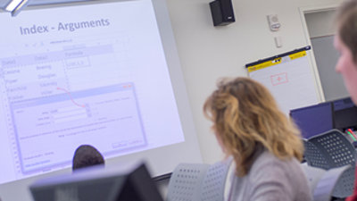 An instructor explains what's on the screen in a non-credit Microsoft Excel class