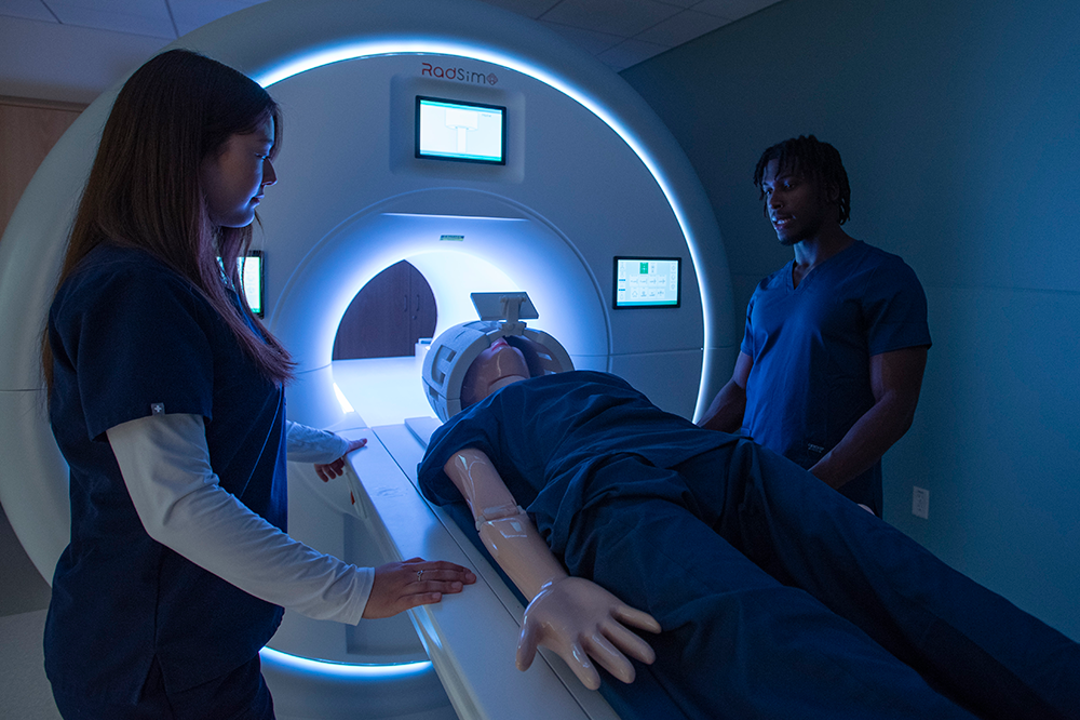Students using the CT Scanner with a practice patient