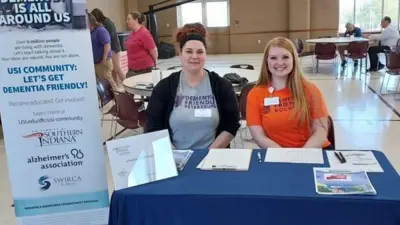 Student volunteers share dementia resources at an information fair