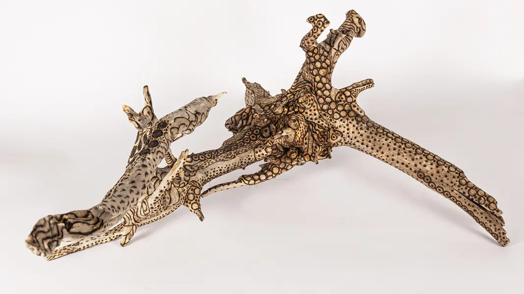 tattooed wood art piece