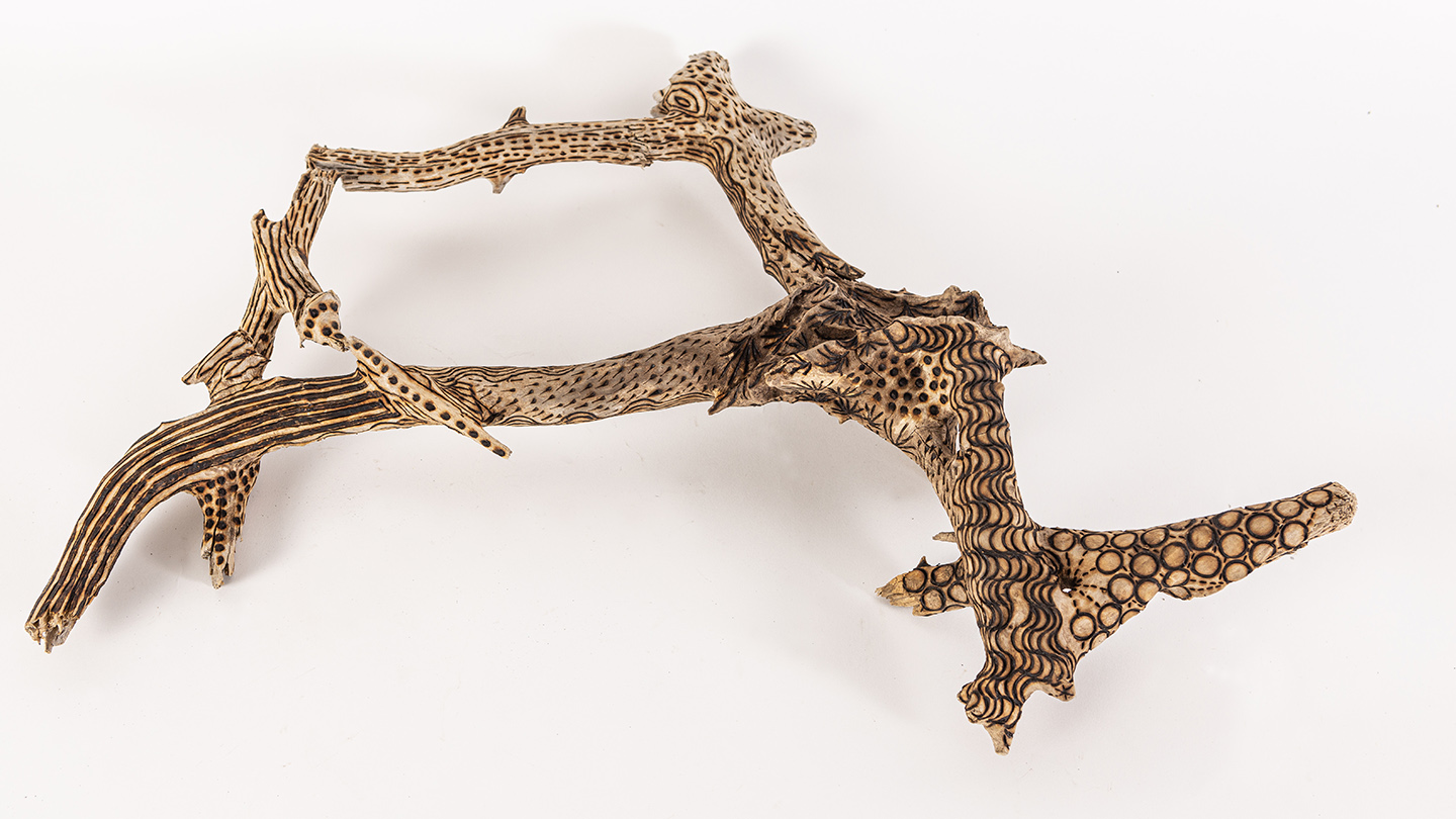 tattooed wood art piece