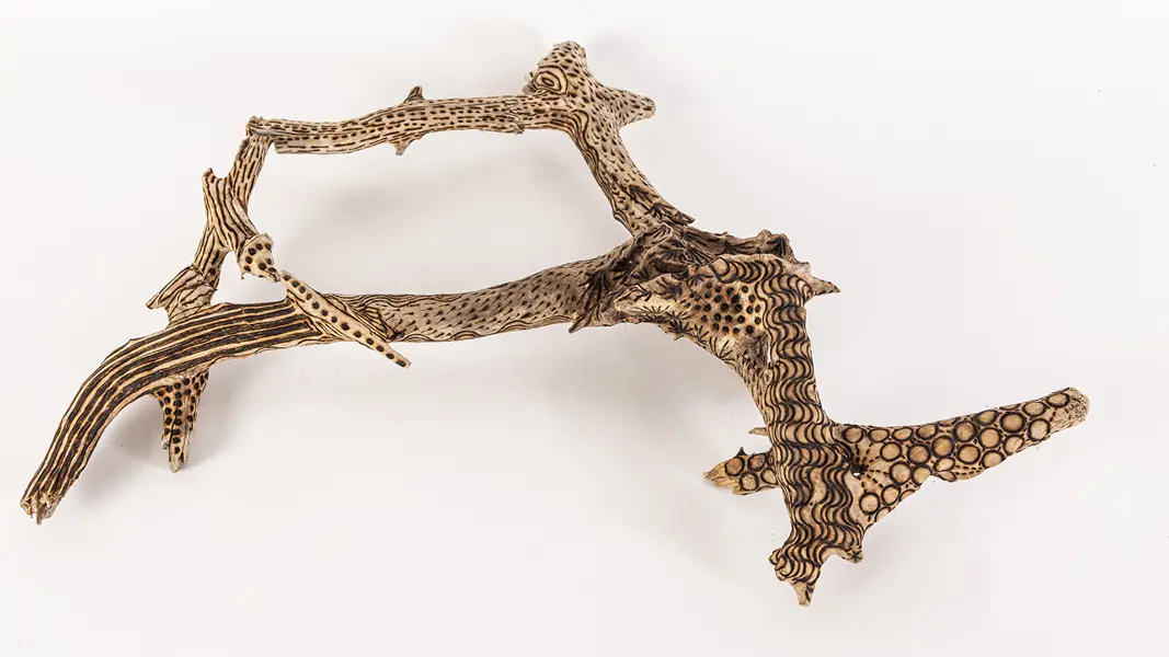 tattooed wood art piece