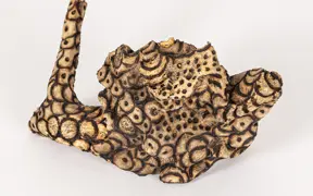 tattooed wood art piece