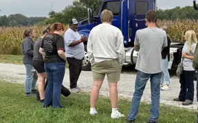 Students learn about commercial trucking and product transportation during a hands-on career exploration activity.