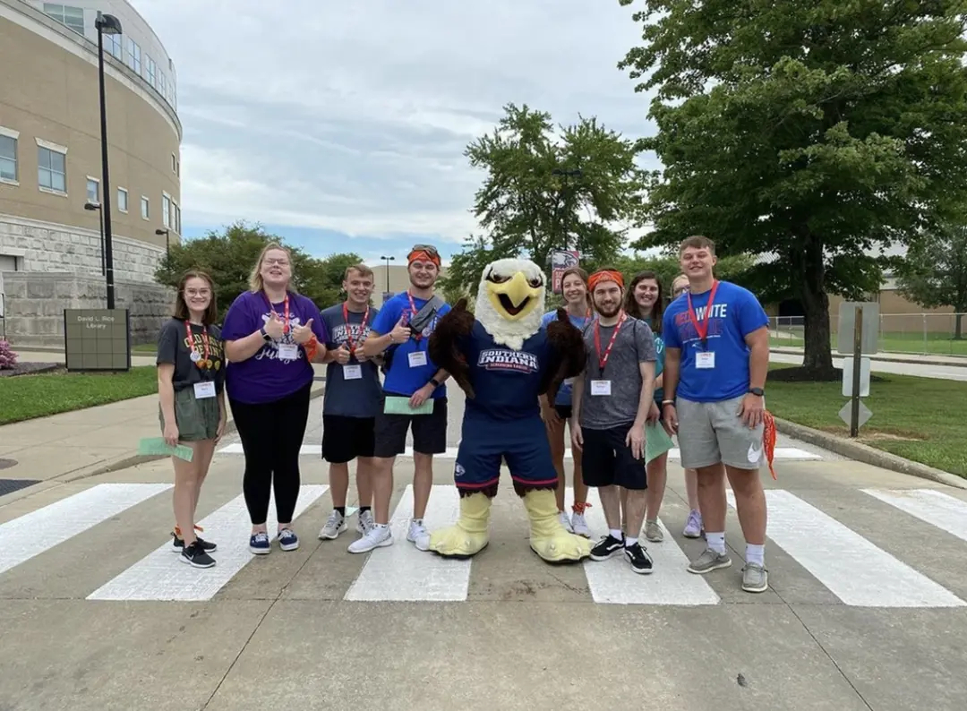 New students pose with Archie Eagle in the University Boulevard crosswalk