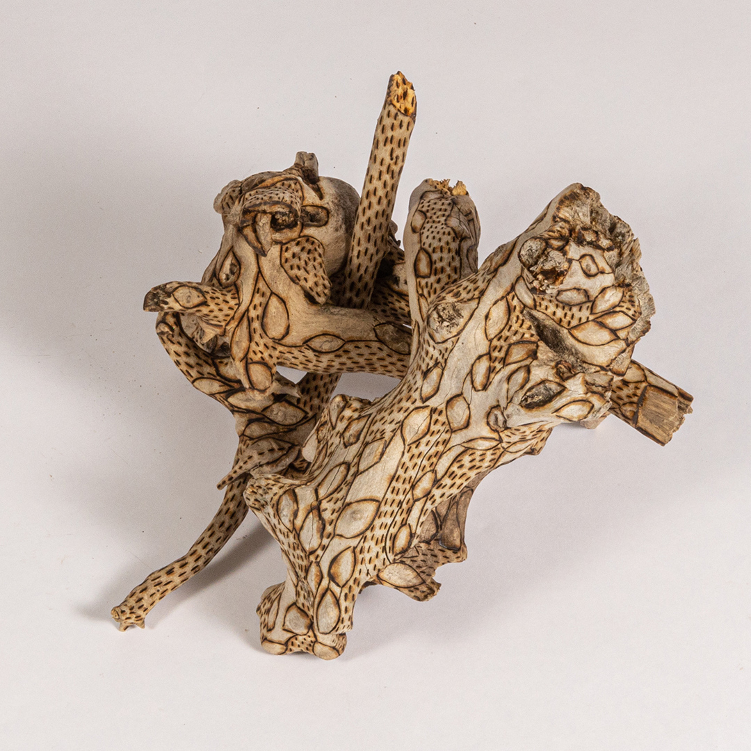 tattooed wood art piece