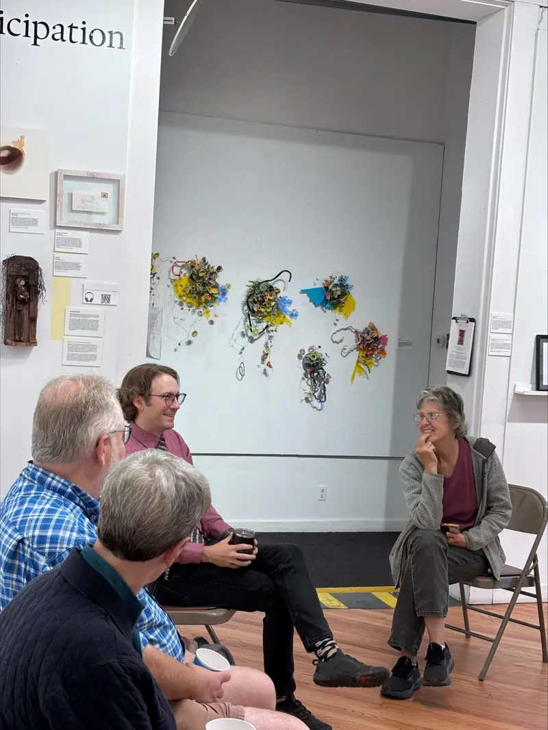 New harmony staff gather together in a circle for a discussion
