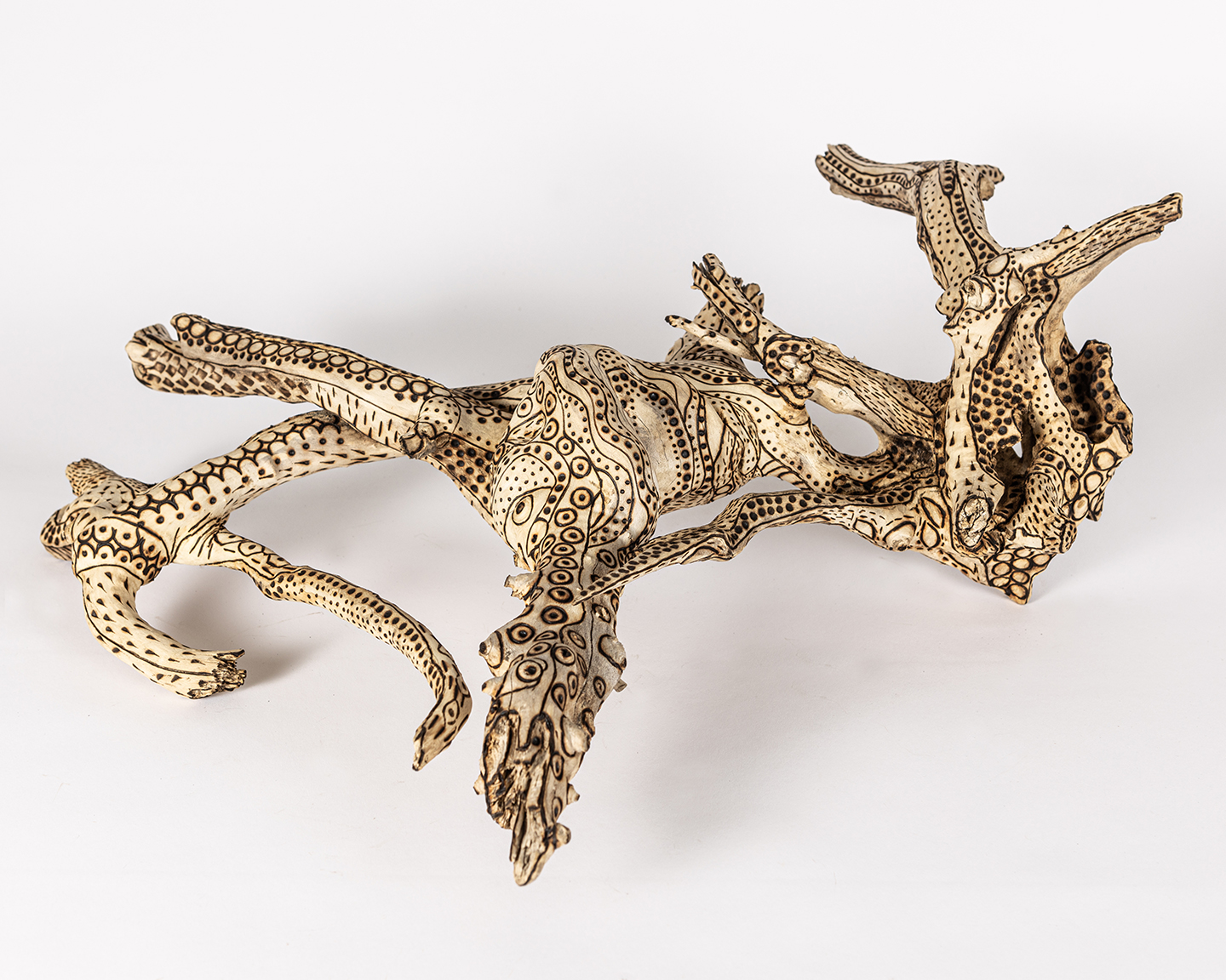 tattooed wood art piece