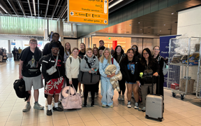Group photo of students at Amsterdam Airport