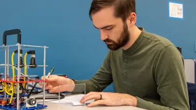 electrical engineering student calibrates ultrasonic sensors in class