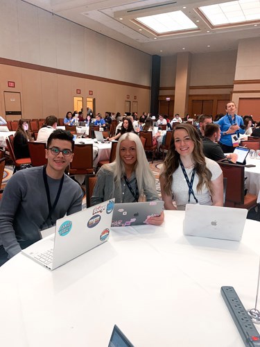 USI students at a table at AMA