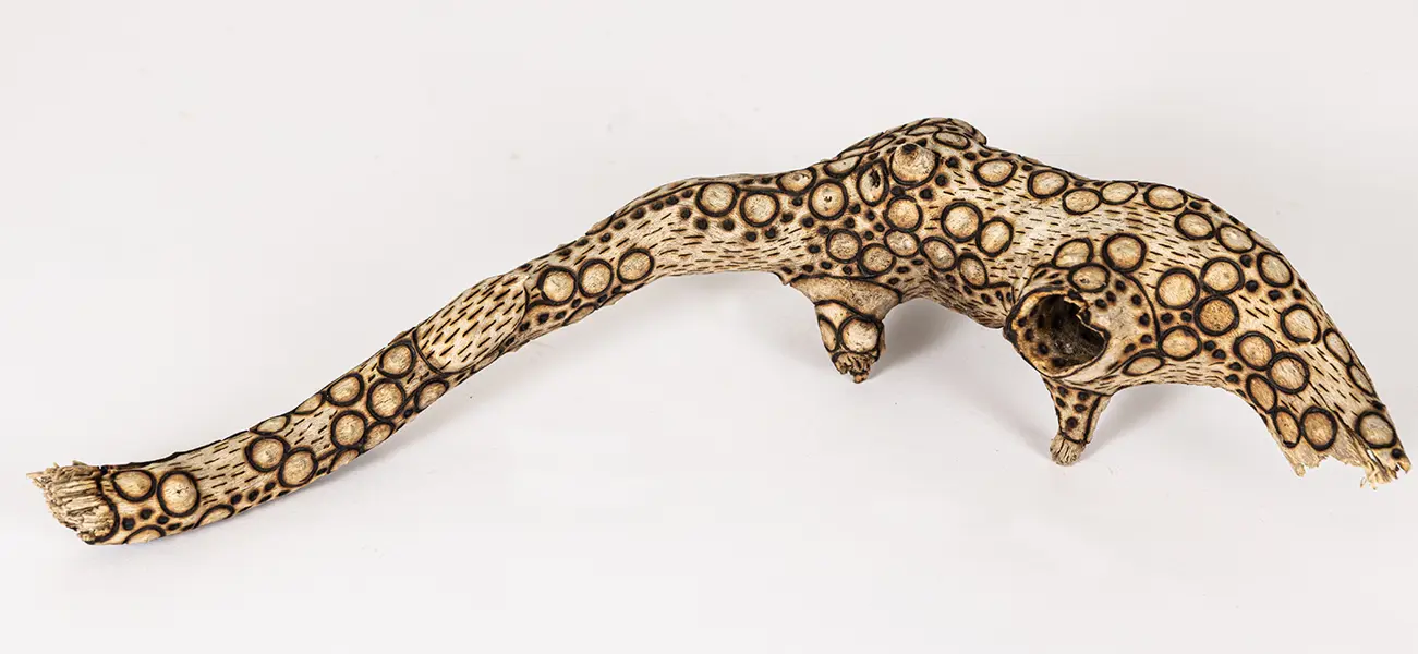 tattooed wood art piece