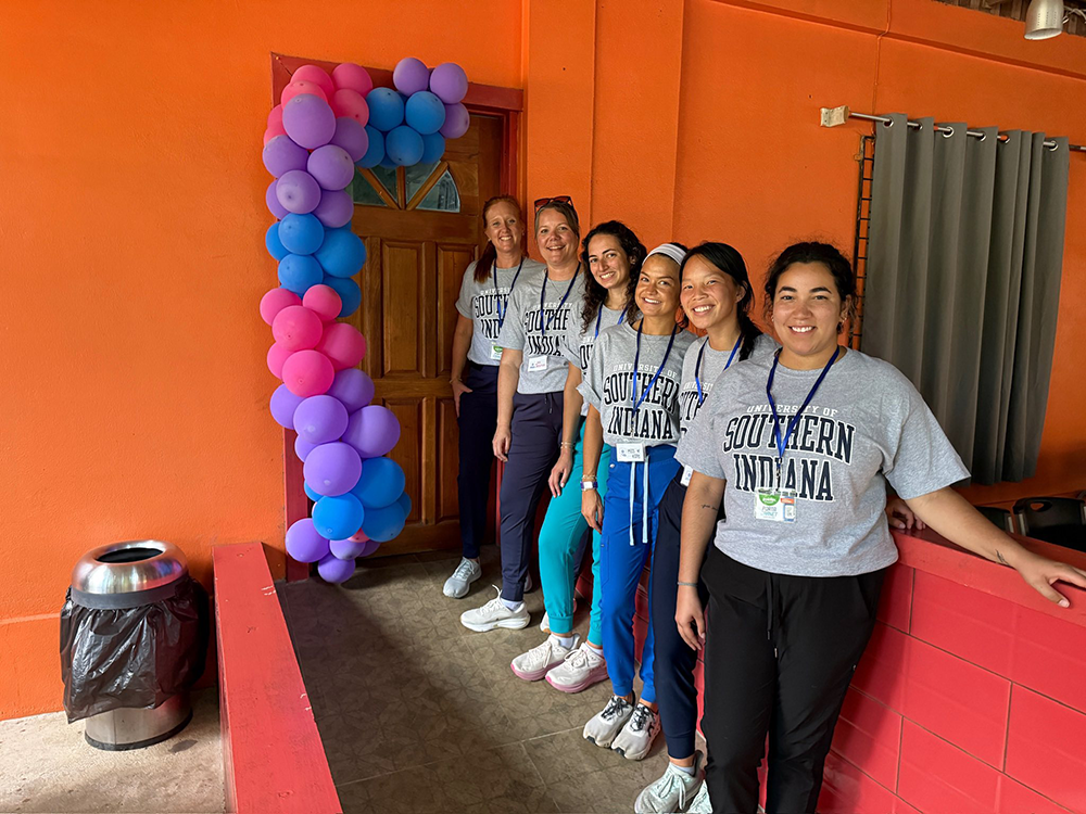 OT students wearing gray USI T-shirts