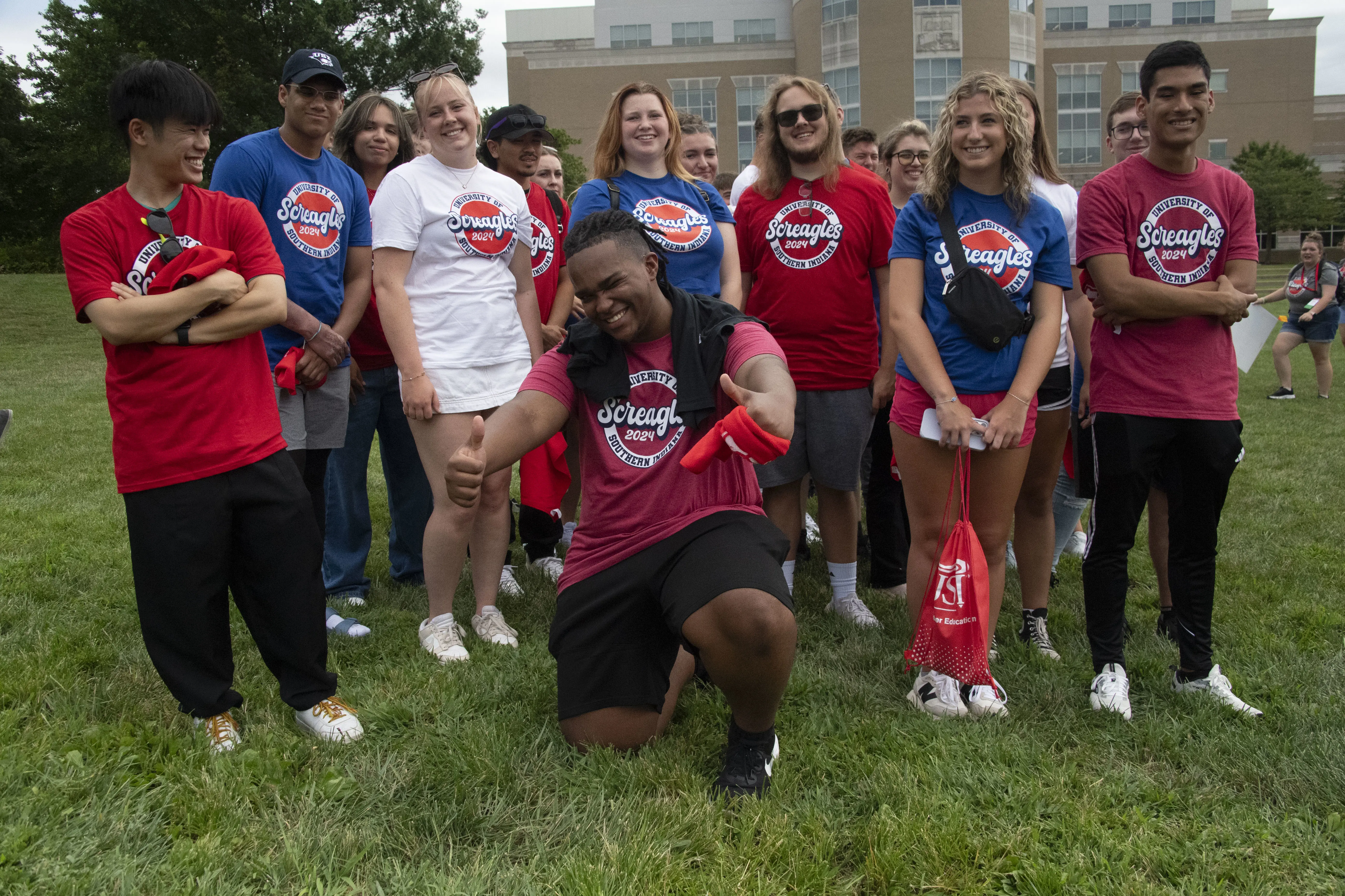 New students in USI logowear gather on the Quad for orientation