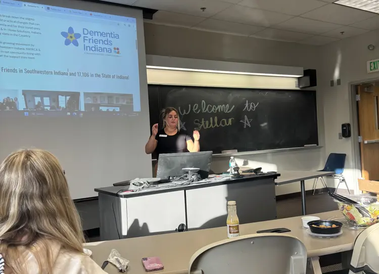 Positive Approach to Care Trainer presenting to STELLAR student organization members