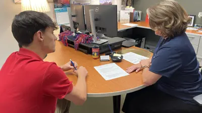 Student and advisor discuss a resume in a career appointment