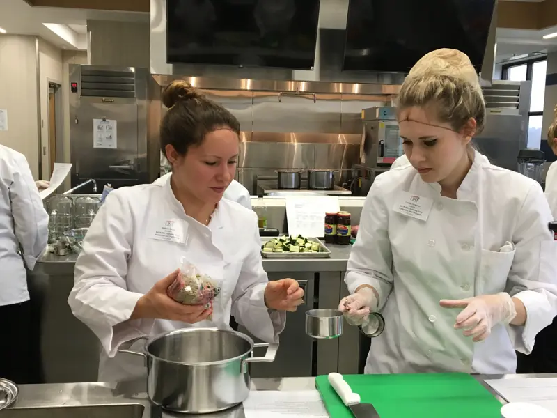 Students using kitchen to prepare food