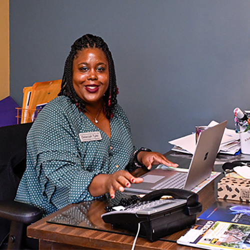 AIT intern sitting at desk