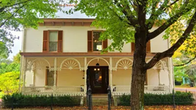 An exterior view of Historic New Harmony's Schnee-Ribeyre-Elliott House in the fall
